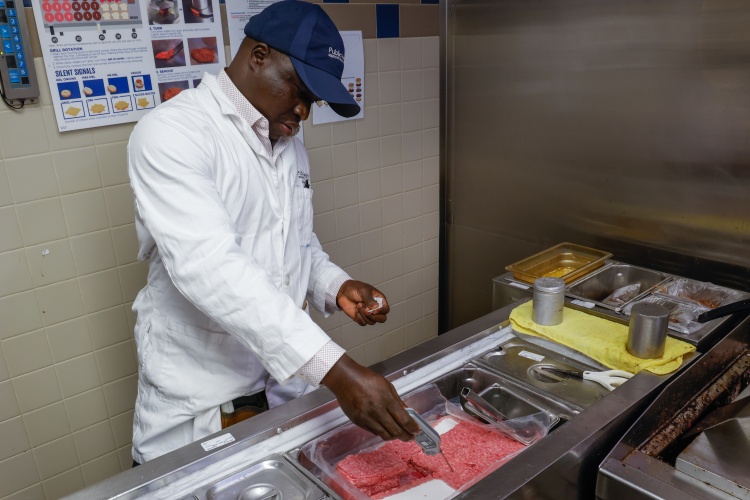 Health department staff checking temperature of meat