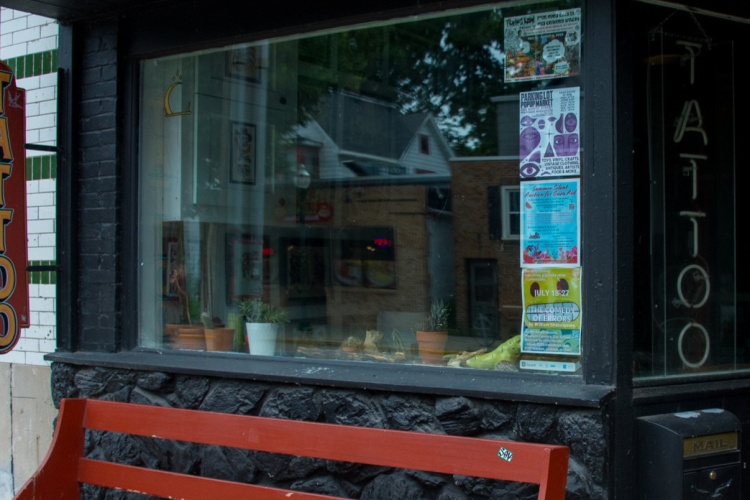 The front window of a tattoo business.