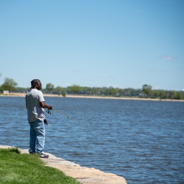 Person fishing in a lake.