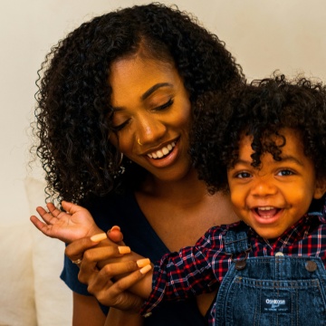 Parent and child laughing.