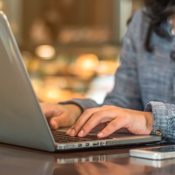 Person typing on laptop