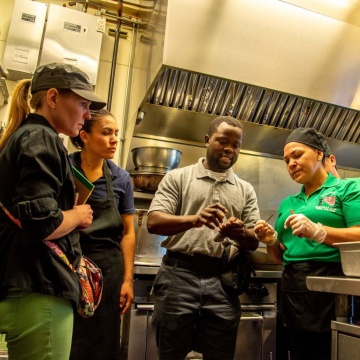 people talking in restaurant kitchen