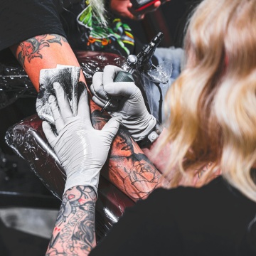 Person getting a tattoo.