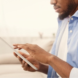 Person using a computer out of focus