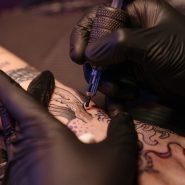 person giving tattoo
